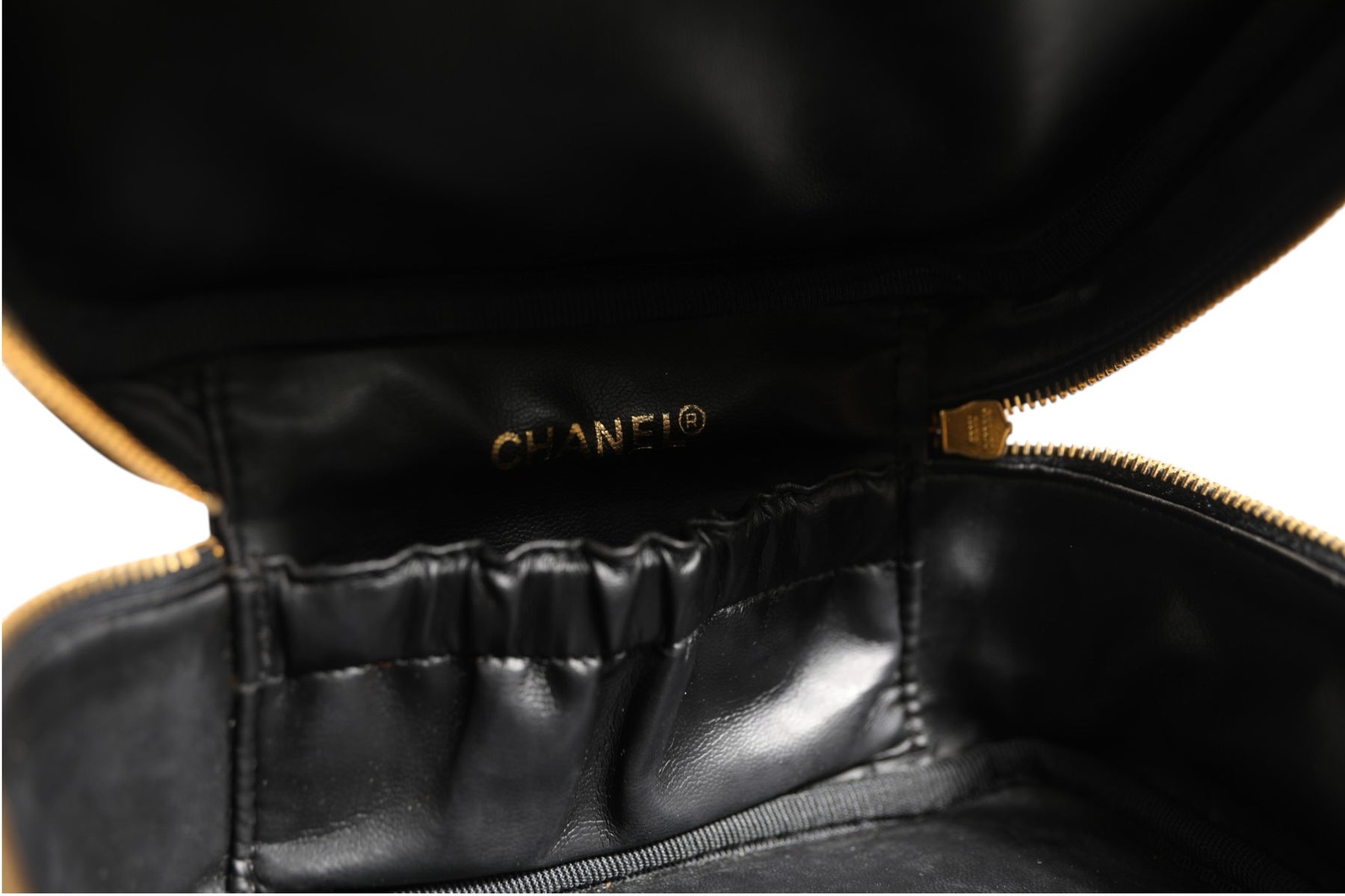 Chanel Black and gold makeup bag | Regal Royce