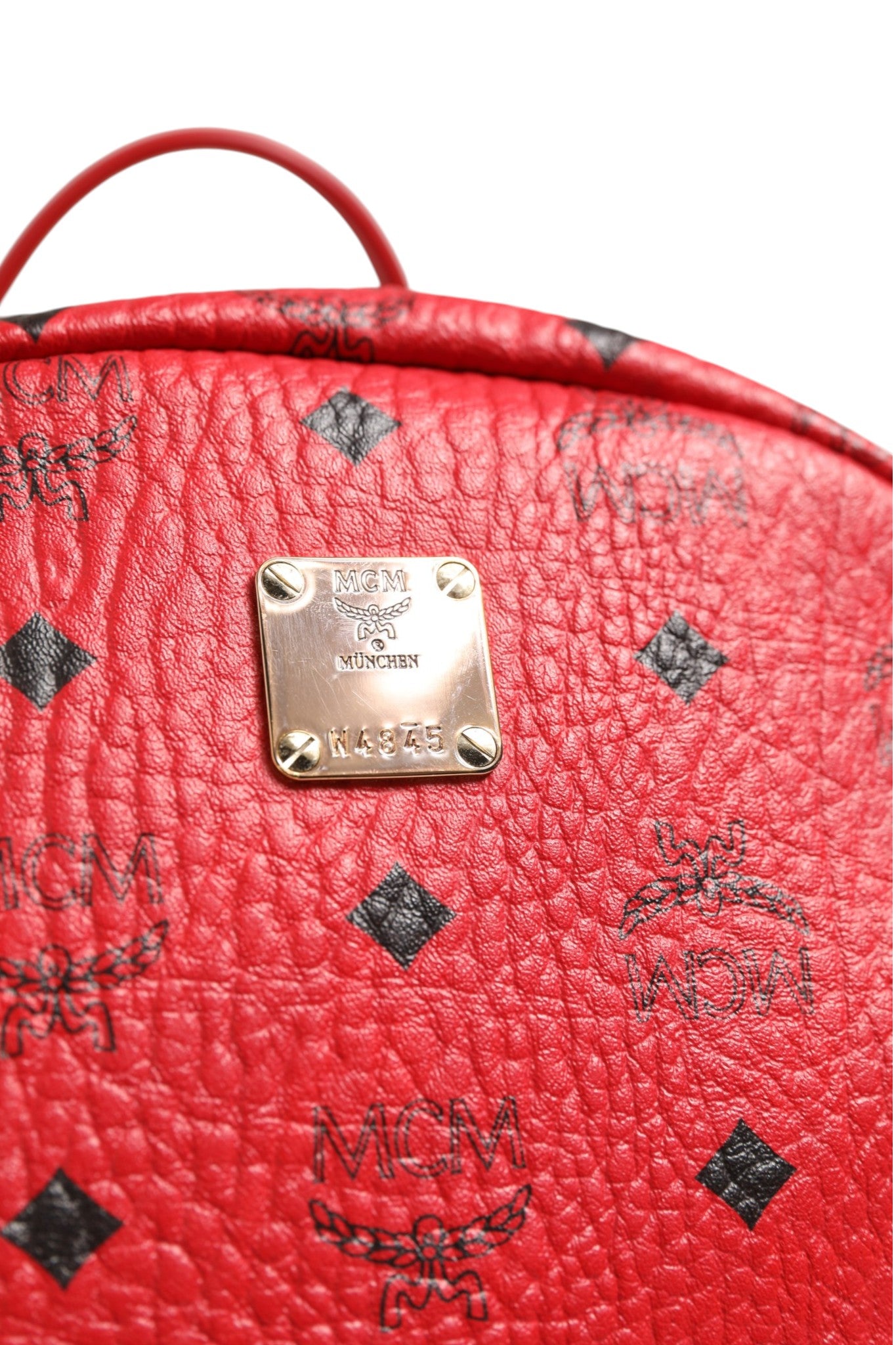 MCM Medium Stark Studded Visetos Backpack - Red | Regal Royce