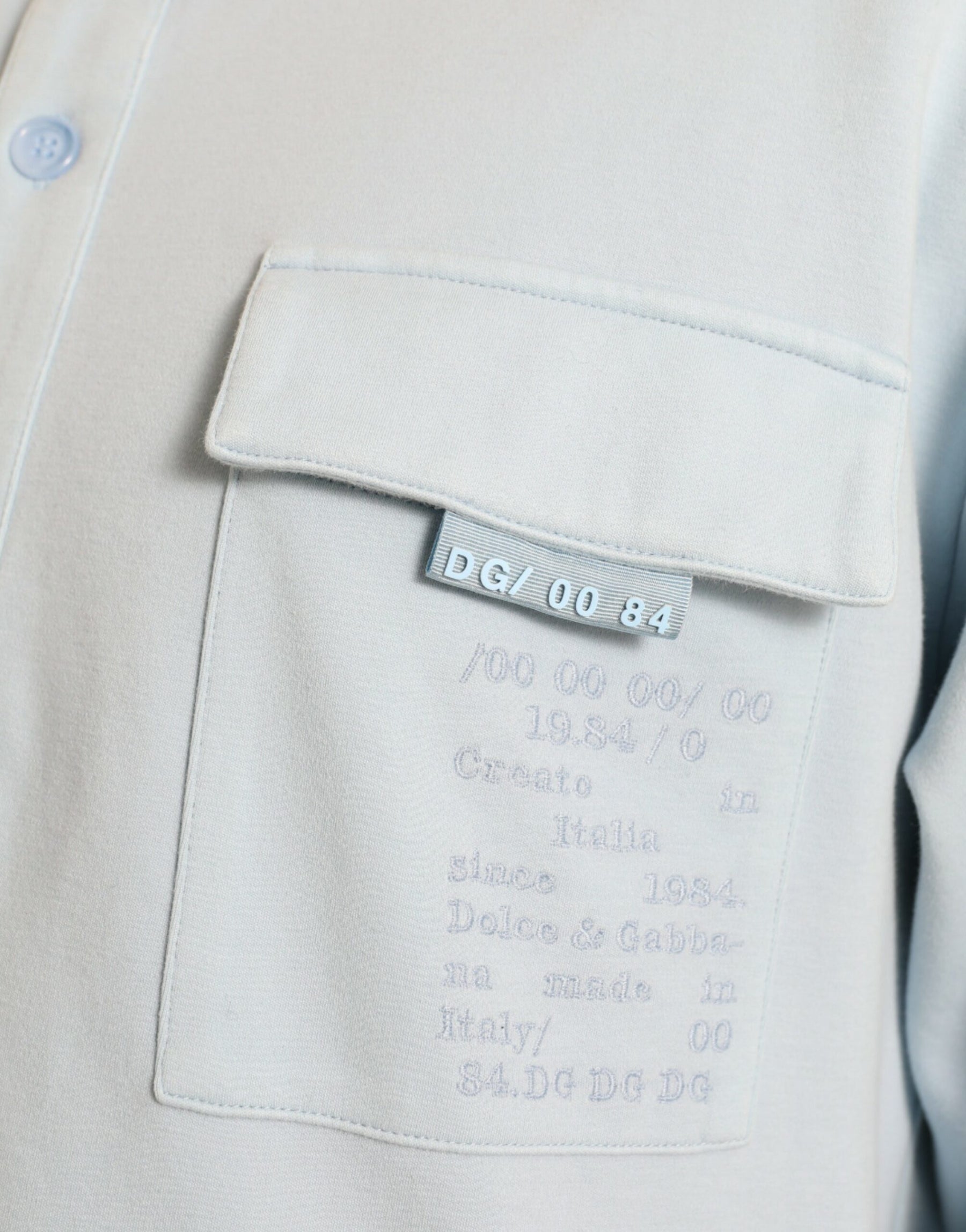 Dolce & Gabbana Light Blue Cotton Buttoned Pullover Sweater | Regal Royce