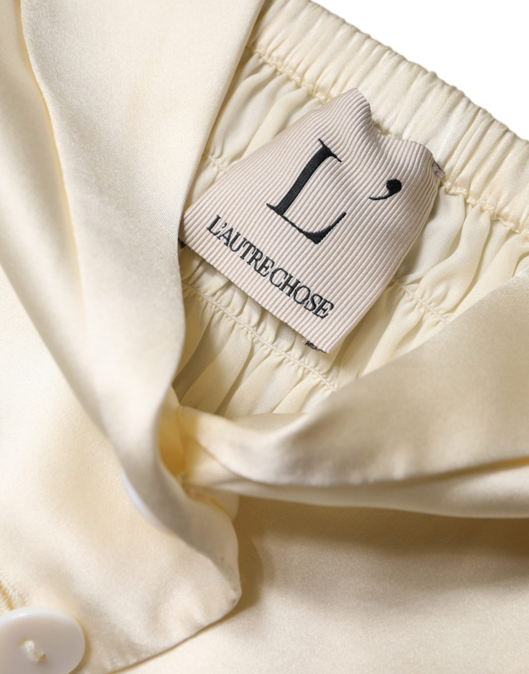 L'Autre Chose Off White Silk Sleeveless Buttoned Halter Top | Regal Royce