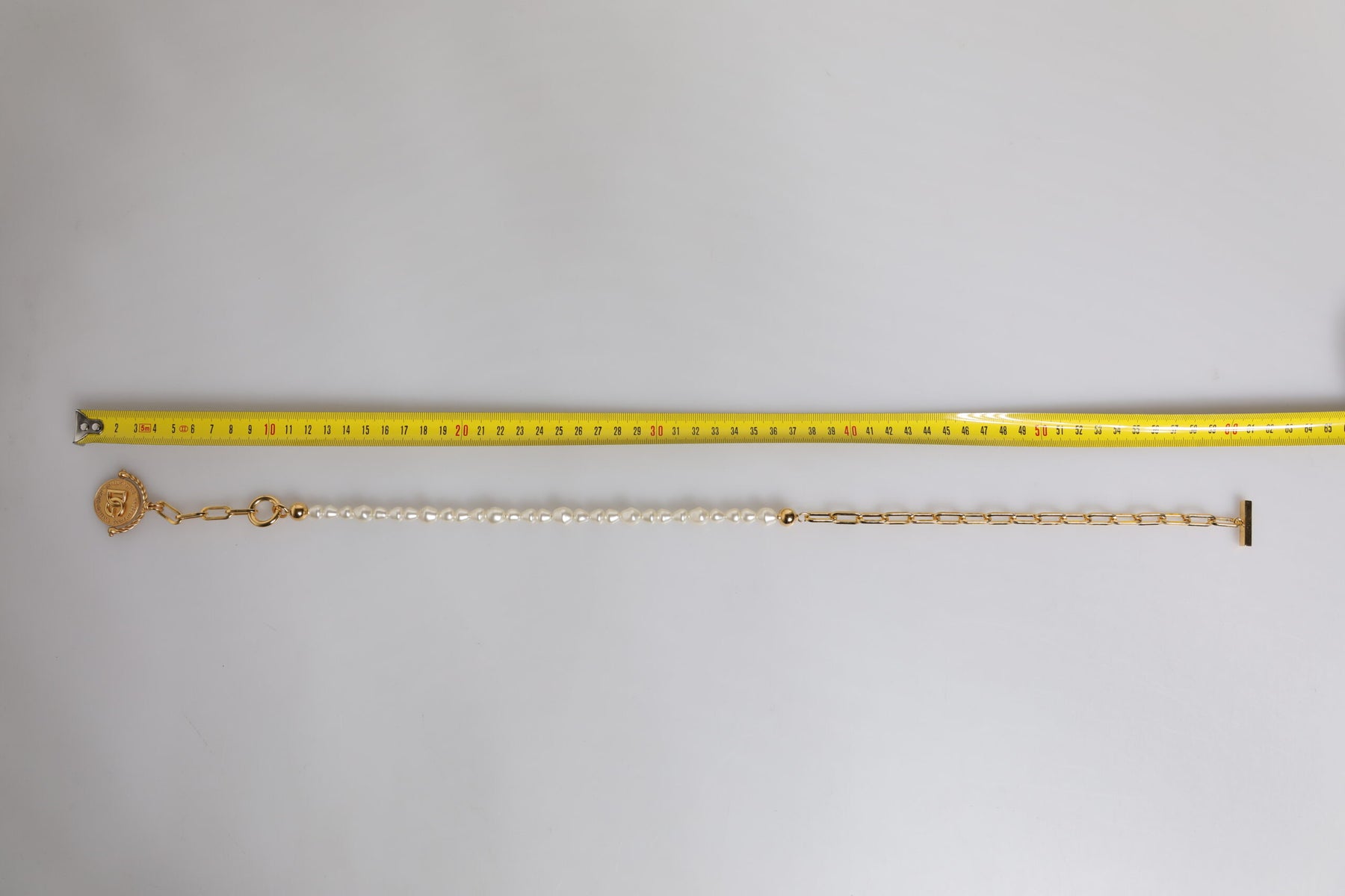 Dolce & Gabbana Gold Chain Brass Faux Pearl Charm Logo Pendant Necklace | Regal Royce