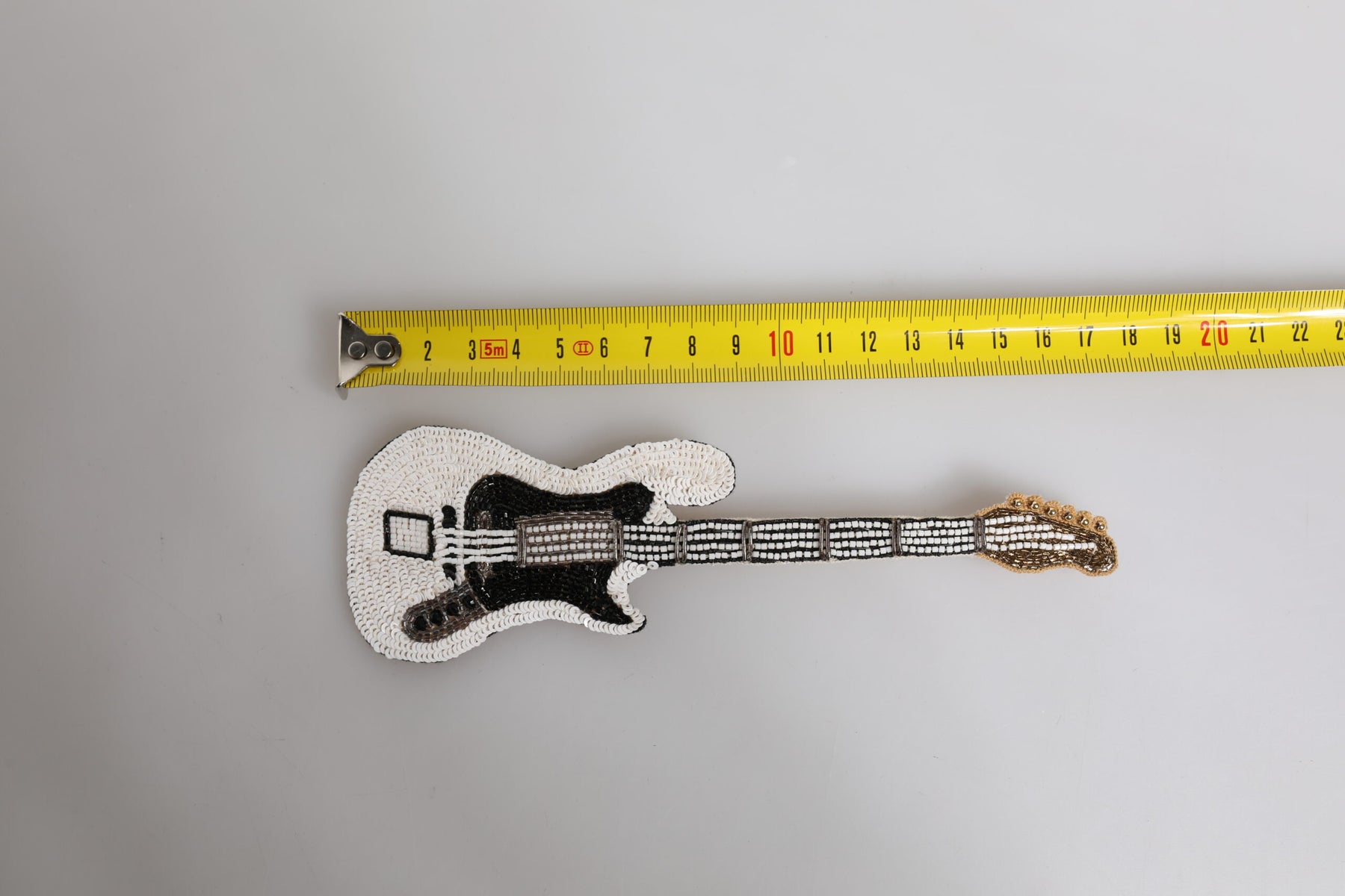 Dolce & Gabbana Gold Brass Logo Beaded Guitar Pin Brooch | Regal Royce