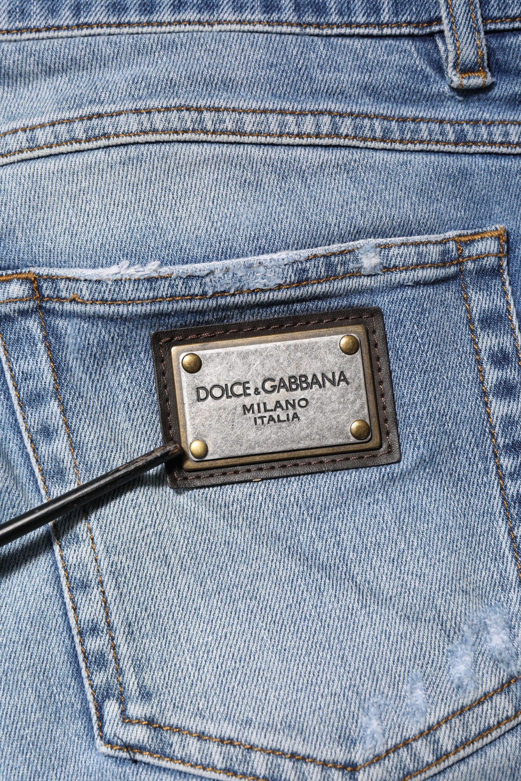 Dolce & Gabbana Blue Washed Tattered Logo Plaque Denim Jeans | Regal Royce