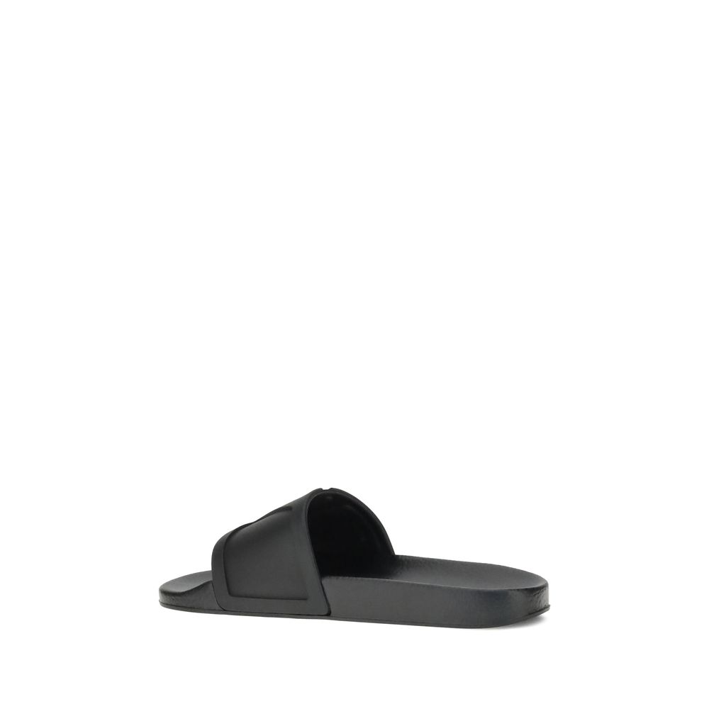 Valentino Garavani Black Rubber Flat Sandals | Regal Royce