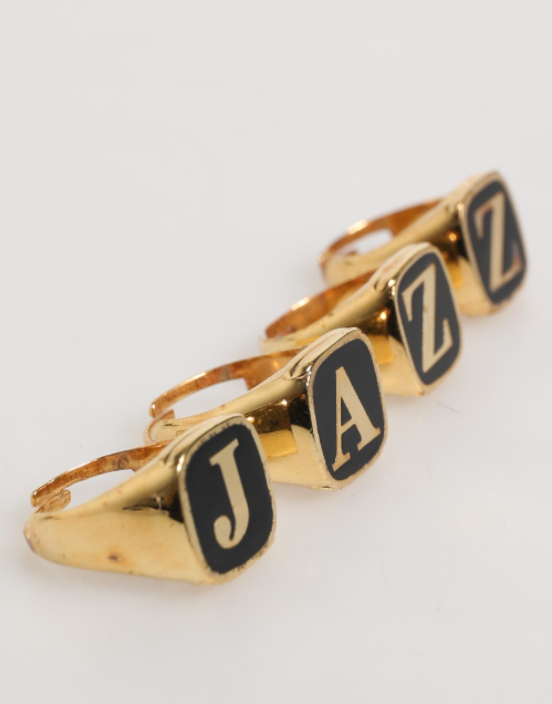 Dolce & Gabbana Gold Tone Brass JAZZ Letter Set 4 Pieces Adjustable Ring | Regal Royce